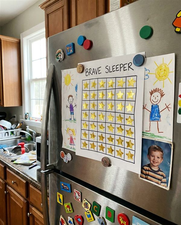 Completed Brave Sleeper star chart on the fridge