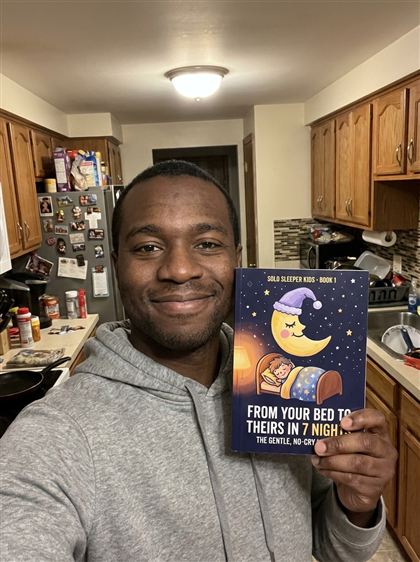 Dad taking a selfie with Book 1